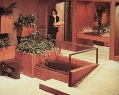 a woman is standing in the middle of a room filled with plants and potted plants