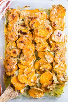 a casserole dish with chicken and sweet potatoes