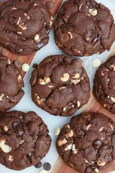 chocolate cookies with white chocolate chips on a cutting board