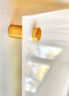 an open door with a gold handle on it