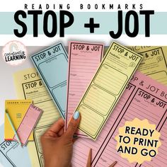 a hand holding a pencil and writing on top of notebooks with the words reading bookmarks stop and jot