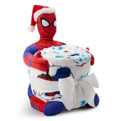 a spider - man diaper cake with a santa hat on it