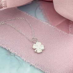 A dainty Silver Initial Charm Necklace with a lucky Four Leaf Clover. This dainty necklace is ideal for layering or wearing as a stand-alone signature necklace. • D E T A I L S •• 10mm charms• Sterling Silver• Dainty Style• 3 chain lengths available (16, 18, and 20 inches) Delicate Sterling Silver Charm Necklaces, Delicate Sterling Silver Charm Necklace, Dainty Flower Pendant Charm Necklace For Good Luck, Dainty Good Luck Flower Pendant Charm Necklace, Dainty Round Pendant Charm Necklace For Good Luck, Dainty Necklace With Adjustable Chain For Good Luck, Dainty Hypoallergenic Pendant Charm Necklaces, Good Luck Charm Necklace With Delicate Chain, Dainty Good Luck Charm Necklace