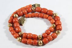 -Antique 10k Gold Natural Dark Orange Coral Barrel Beaded Necklace -Total length:about 17 in -Coral size: 6 mm x 5.7 mm ~ 10.9 mm x 10.2 mm -Gold ball size: 7.65 mm -Total weight: 48.3 g -Tested 10k Carnelian Earrings, Large Pendant Necklace, Coral Pendant, Green Chalcedony, Orange Coral, Dark Orange, Sleeping Beauty Turquoise