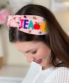 Celebrate your favorite teacher in style with our "TEACH" Multicolor Teacher Appreciation Crystal Rhinestone Beaded Top Knotted Headband! This headband is a heartfelt and fashionable tribute to educators, adorned with vibrant seed beads that spell out the word "TEACH." The top-knotted design adds a playful touch, making it a standout accessory for teacher appreciation.
With a generous width of 6.5" and a height of 3", this headband not only makes a bold statement but also ensures comfort throughout the day. Whether your favorite teacher is attending school events, virtual classes, or simply enjoying some well-deserved recognition, this headband is the perfect way to show appreciation with style. Gift your favorite teacher a touch of glamour and gratitude with this unique and meaningful hea Teacher Headbands, Leopard Headband, Minnie Mouse Headband, Minnie Ears Headband, Top Knot Headband, Rhinestone Hair Pin, Party Headband, Winter Headbands, Pink Headbands