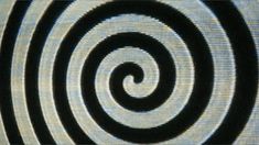 a black and white spiral pattern is shown