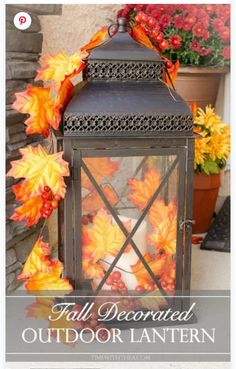 an outdoor lantern with fall leaves on it and the words, fall decorated outdoor lantern