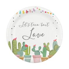 a paper plate that says let's be loved with cactuses and pomegranates