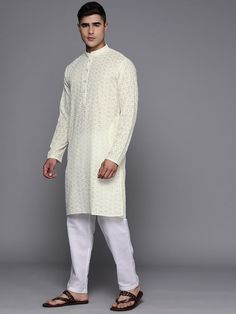 Off white embroidered Kurta with TrousersKurta design:Ethnic motifs embroideredStraight shapeRegular styleMandarin collar, long regular sleeves2 pockets chikankari detailCalf length with straight hemCotton blend machine weave fabricTrousers design:Solid TrousersPartially elasticated waistbandHook and eye closure Chikankari Kurta, Ethnic Motifs, Anarkali Kurta, Kurta Designs, Thread Work, Mandarin Collar, Body Measurements, Woven Fabric, Quality Fabric