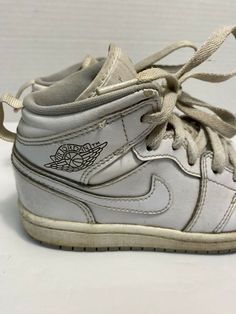 Kids Nike Air Jordan Retro 1 White Wolf Gray 640734-112 TD Sz 12c athletic shoes.  General wear throughout.  Fair condition.  Creasing to toes.  Some of midsole is loose.  Sold as pictured. Vintage Basketball Shoes With Boost Midsole And Round Toe, Vintage Synthetic Sneakers For Sports, Vintage Synthetic Sports Sneakers, Vintage Style Synthetic Sports Sneakers, Vintage Lace-up Synthetic Sneakers, Vintage White Basketball Shoes With Boost Midsole, Vintage White Custom Sneakers For Sports, Vintage Lace-up Basketball Shoes, Air Jordan Retro 1