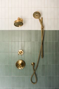 a shower head and hand shower in a bathroom