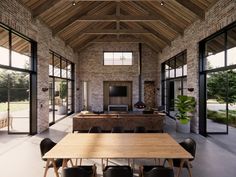 a large open living room with wooden tables and black chairs in front of the windows