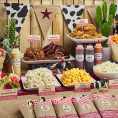 a table filled with different types of food and condiments on top of it