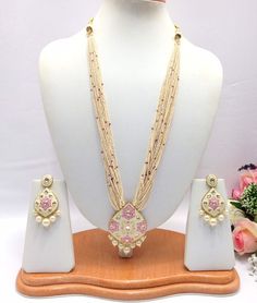 "Handmade Kundan Meenakari Long Necklace Haar/Mala Indian Necklace Set with Earrings, Indian wedding, Bollywood Jewelry, Pakistani jewellery Type : Polki Kundan Meenakari Multi Strand Necklace Set, Necklace Length: 12\"inches Approx + Adjustable Necklace Thread. It is a perfect match with formal attire on special occasions or with casual wearing.  Slight Colour variations possible due to difference in screen and photograph Care instructions Keep Jewellery away from direct heat, water, perfumes, deodorants and other strong chemicals as they may react with the metal or plating. The plating composition of Jewellery is as such that  perspiration (sweat) will not damage it. Wipe Jewellery gently with chamois cloth or leather swatch after every use. Wiping the jewellery with a soft cloth after r Ceremonial Meenakari Jewelry Sets For Diwali, White Meenakari Jewelry Sets For Celebration, Ceremonial White Meenakari Jewelry Sets, Festive White Meenakari Jewelry Sets, Traditional Handmade Bridal Sets, Kundan Jewelry Set With Meenakari For Celebration, Traditional Meenakari Jewelry Sets For Festivals, Pink Meenakari Jewelry For Ceremonial Occasions, Traditional Meenakari Jewelry Sets For Celebration