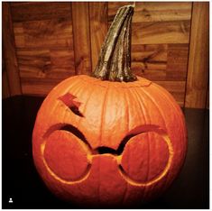 a carved pumpkin with glasses on it