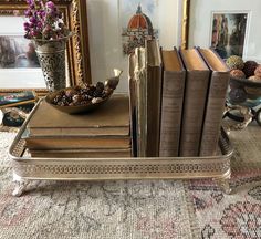 a silver tray with books on top of it