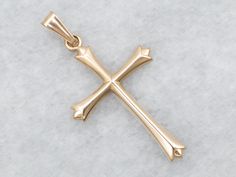 This classic yellow gold pendant is delicate and dainty, perfect for adding a sweet, subtle touch of faith to your look. Whether you choose to accessorize for a special occasion or just to bring a little joy to a regular day, this delightful cross will brighten up any ensemble!This pendant does not come with the chain shown. Don't hesitate to get in touch with us, we will help you find the perfect chain for your style and budget!Metal: 14K Yellow GoldMeasurements: 14 x 26 mm, with bailMarks: "14K USA" Stamped on the reverse Yellow Gold Cross Pendant Necklace For Weddings, Yellow Gold Crucifix Cross Necklace For Wedding, Yellow Gold Crucifix Necklace For Weddings, Wedding Yellow Gold Cross Pendant Necklace, Classic Cross Pendant Jewelry For First Communion, Elegant Yellow Gold Cross Pendant Necklace, Elegant Cross Pendant Necklace For Wedding, Elegant Cross Jewelry For First Communion, Elegant Yellow Gold Crucifix Necklace