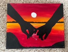 two hands holding each other over a sunset painting on canvases with the moon in the background