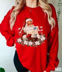 Santa Claus Christmas Sweatshirt Cotton Sweater With Graphic Print As Gift, Graphic Print Cotton Sweater As Gift, Cotton Long Sleeve Sweatshirt For Holiday, Holiday Cotton Sweatshirt With Long Sleeves, Vintage Crew Neck Top For Holiday, Graphic Print Cotton Sweater, Vintage Crew Neck Top As Gift, Holiday Sweatshirt With Graphic Print, Christmas Gift Cotton Sweater