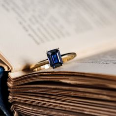 a ring sitting on top of an open book