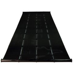 a black mat that is laying on top of a white background with no people around it