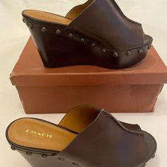 Nwt Coach, Helena Semi Matte Calf. Chocolate Brown Leather With Stud Decorations. Never Worn. With Box. Casual Coach Leather Heels, Casual Leather Coach Heels, Coach Leather Slip-on Heels, Casual Brown Coach Heels, Leather Mules, Coach Shoes, Mule Clogs, Mules Shoes, Chocolate Brown