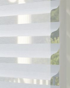 a window with white blinds in front of it