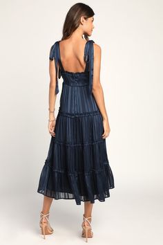 Be the belle of the event when you arrive in the Lulus Day for Romance Navy Blue Tie-Strap Tiered Midi Dress! Lightweight, woven chiffon boasts satin stripes outlined with sparkly lurex threading throughout as it shapes a ruffle-trimmed straight neckline and tying shoulder straps. A flowy silhouette boasts ruffled tiers before ending at a midi hem. Hidden back zipper/clasp. Fit: This garment fits true to size. Length: Mid-calf length. Size medium measures 43" from top to bottom. Bust: Works best for A to C cup sizes - consider sizing up for fuller bust. Waist: Not Fitted - comfortable room throughout midsection. Hip: Not Fitted - fuller skirt allows room for hips. Undergarments: May be worn with a strapless bra, adhesive bra, petals, or no bra. Fabric: Fabric has no stretch. Lined. Shell: Burgundy Skater Dress, Dress Tea Length, Navy Blue Midi Dress, Tea Length Wedding, Navy Blue Tie, Evening Dresses Cocktail, Midi Ruffle Dress, Tiered Midi Dress, Striped Midi Dress