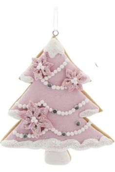 a pink christmas tree ornament hanging from a hook