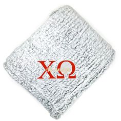 a white blanket with the word xo on it and a red q2 logo