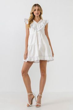 Elevate your style with this chic mini dress. With its eye-catching contrast embroidery details, this dress is sure to turn heads. The ruffled neck and V neckline give it a girly touch, while the mini length makes it perfect for showing off your legs. Add this dress to your collection and wear it for any special occasi Chic Mini Dress, Ruffled Mini Dress, Tiered Midi Dress, Striped Midi Dress, Ruffle Mini Dress, Pleated Midi Dress, Tiered Maxi Dress, 80 Dress, Straight Leg Trousers