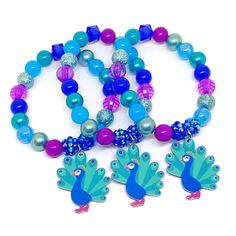 These adorable bracelets are the perfect favor for your little one's peacock themed party! Each bracelet is made using a resin peacock charm and an assortment of plum, blue, teal green, royal blue and cyan 10mm acrylic beads strung with durable stretch floss cord. Each bracelet will arrive individually packaged in organza bags. Select the number of bracelets and bracelet size needed from the drop down menus. Please message me if you have any questions. Turn your bracelets into fun diy kits with Resin Peacock, Peacock Birthday Party, American Girl Birthday Party, Spa Party Favors, Peacock Party, Peacock Wedding Theme, Party Favors Birthday, Girls Tea Party, Favors Birthday