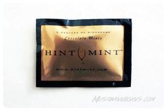 a chocolate bar wrapped in foil on top of a white surface with the word hunt mint