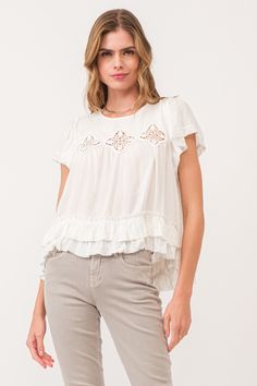 image of a female model wearing a VADA EMBROIDERY MOTIF BLOUSE WHITE DEAR JOHN DENIM Bohemian Spring Lace Top With Short Sleeves, Bohemian Short Sleeve Lace Top For Spring, Summer Tops With Lace Trim And Ruffle Sleeves, Summer Ruffle Sleeve Tops With Lace Trim, Ruffle Sleeve Tops With Lace Trim For Summer, Casual Lace Top Blouse With Ruffle Sleeves, Casual Blouse With Lace Top And Ruffle Sleeves, Casual Broderie Anglaise Lace Top For Summer, Feminine Short Sleeve Blouse With Crochet Trim