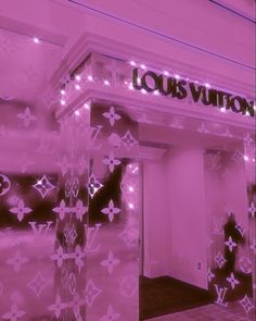 the louis vuitton store front is covered in pink lights and decorated with stars