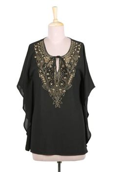 Shashi Sehgal designs a stunning long tunic with a loose flowing fit. Applied by hand lavish golden beadwork flows down the front to swirl in floral arabesques adding drama to the black polyester top. This glamorous design is semi-sheer and can be worn over a camisole (not included). It ties at the neck. Fire Kingdom, Embroidered Cotton Top, Long Tunic, Polyester Top, Linen Dresses, Cotton Blouses, Nice Tops, Cotton Tops, White Long Sleeve