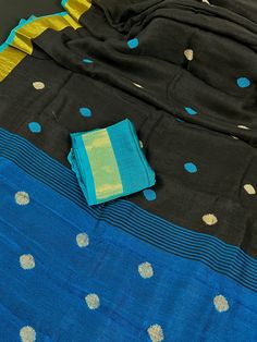 Gorgeous Pure Handloom Saree in Teal and Black Color combination with Gicha Buttas all over the body of the Saree. The borders have Zari Weave. Item : SareeColor : Teal Blue and Black Base Fabric : Pure Handloom Linen Blouse piece : Comes with un-stitched Blouse piece.Blouse material : Pure Handloom Linen Fall & Edging(Yes/No) : Yes Disclaimer -:- Color variation is possible due to various reasons like phone or desktop setting, resolution etc. Please don't hold us responsible. Our aim is to put Festive Black Slub Silk Traditional Wear, Black Slub Silk Traditional Wear For Festivals, Black Slub Silk Traditional Wear For Diwali, Black Zari Weaving Sets For Festivals, Black Dupatta With Zari Work In Slub Silk, Black Slub Silk Dupatta For Festivals, Black Slub Silk Dupatta With Self Design, Black Handloom Slub Silk Traditional Wear, Black Slub Silk Saree With Cutdana