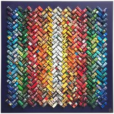 an art piece made out of many different colored cars