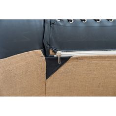 the back end of a couch with zippers on it's sides and an attached seat