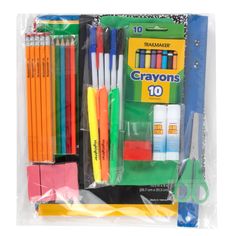 crayons and markers in plastic bag on white background