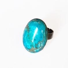 Turquoise blue and bronze ring with oval cabochon (18x25mm) in ocean jasper and sea sediments on adjustable bronze support. Each cabochon is unique. "Sea bathing" ring, "L'aimer l'ange" collection, Fanciful Félicité. Adjustable Turquoise Oval Rings, Adjustable Turquoise Ring With Patina For Gift, Adjustable Oval Turquoise Ring Nickel Free, Adjustable Oval Turquoise Ring With Patina, Unique Adjustable Turquoise Ring With Natural Stones, Handmade Adjustable Oval Turquoise Ring, Unique Adjustable Turquoise Ring With Patina, Adjustable Oval Turquoise Ring With Large Stone, Adjustable Cabochon Turquoise Ring In Bohemian Style