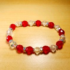 Handmade By Me. Beautiful Red And Clear Crystal Aurora Borealis Beads With Rhinestone Spacers Stretch Bead Bracelet. One Of A Kind! Can Be Worn For A Special Occasion, To The Office, Or To Jazz Up A Casual Outfit. Fits Up To 6 1/2" Wrist. Great For Gifts! The Stretch Cord Will Stretch To Fit, But Then Bounce Back To Its Original Size. Red Faceted Beads Bracelet, Traditional Red Faceted Beads Bracelet, Red Faceted Beads Bracelet As A Gift, Red Faceted Beaded Bracelet As A Gift, Red Faceted Bead Bracelets As Gift, Red Beaded Bracelets With Faceted Beads For Gift, Elegant Red Crystal Bracelet With 8mm Beads, Elegant Red Stretch Bracelet With 8mm Beads, Adjustable Red Faceted Beads