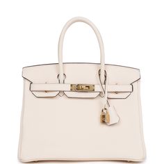 This Birkin is in Nata clemence leather with gold hardware and has tonal stitching, front flap, two straps with center toggle closure, clochette with lock and two keys, and double rolled handles.The interior is lined with Nata chevre and has one zip pocket with an Hermes engraved zipper pull and an open pocket on the opposite side.Collection: BOrigin: FranceCondition: New and never worn (Plastic on hardware)Accompanied by: Hermes box, Hermes dustbag, clochette, lock, two keys, clochette, clochette dustbag, carebook, feltMeasurements: 11.75" width x 9.5" height x 6" depth; 4.25" handle drop Cream Birkin Bag, Birkin 30 Gold, Hermes Picotin 18cm, Hermes Birkin 30 Gold, Mini 24/24 Hermes, Hermes Birkin Handbags, Birkin Handbags, Hermes Birkin 25, Hermes Box