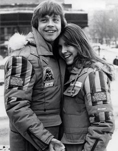 a man and woman in uniform posing for a photo