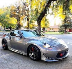 a silver sports car parked in a parking lot