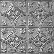 an ornate metal ceiling tile with flowers and leaves on the center, is shown in silver