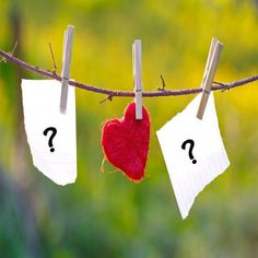 two pieces of paper hanging from a clothes line with the word frame written on them