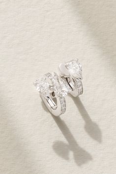 Repossi's single earring is part of 'Serti Sur Vide', which aligns with the jeweler's avant-garde collection. It's handcrafted from shining 18-karat white gold and set with a modern trio of pear-cut pavé diamonds. The sparkling design sculpts your lobe as if it's artistically floating. Luxury Pear-shaped Single Cut Diamond Earrings, Luxury Polished Diamond Earrings For Anniversary, Luxury White Earrings With Single Cut Diamonds, Luxury Diamond Earrings For Anniversary With Polished Finish, Luxury Teardrop Diamond Earrings With Single Cut Diamonds, White Luxury Earrings With Single Cut Diamonds, Luxury White Gold Huggie Earrings, Luxury Sterling Silver Pear-shaped Earrings, Luxury Pear-shaped Sterling Silver Earrings