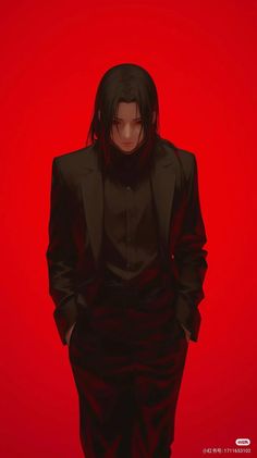 a man in a black suit and tie standing against a red background with his hands on his hips