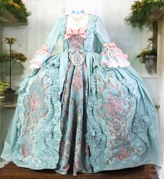 A beautiful, high quality fully handmade 18th century gown. The dress is inspired by fashion from the times of Marie Antoinette, made of taffeta. It has rich decorations typical of that era. The dress can be made in any color variation and in sizes ranging from 34 to 44. The estimated production time is about 8 weeks. We always ask for accurate measurements in order to create a perfectly tailored gown. The dress is created based on individual order. Therefore, before making a purchase, please co French 1700s Aesthetic, Marie Antionette Outfits, Marie Antoinette Victorian Dress For Fancy Dress, Marie Antoinette Victorian Dress With Fitted Bodice, Fitted Victorian Baroque Dress In Marie Antoinette Style, Fitted Victorian Dress In Marie Antoinette Style, Fitted Victorian Marie Antoinette Dress, 18th Century Baroque Dress For Costume Party, Marie Antoinette Style Historical Ball Gown